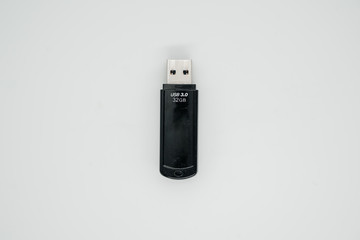 Old usb flash drive on a light background close up