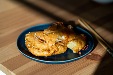 Fried Pineapple Fritters Caramelized with Cinnamon and Sesame Seeds.