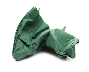 Crumpled green paper serviette, napkin isolated on white background