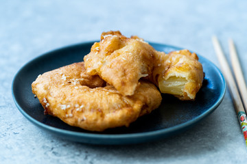 Fried Pineapple Fritters Caramelized with Cinnamon and Sesame Seeds.