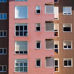 window on the pink facade of the house in Bilbao city, Spain