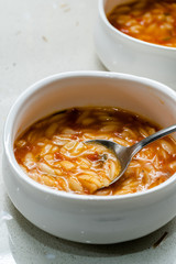 Homemade Tomato Soup with Orzo Barley and Spoon.