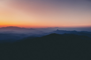 landscape mountains forests sky in the evening