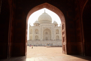 Fototapeta premium Agra, Uttar Pradesh, India - April, 2014: Side view of The Taj Mahal mausoleum, one of the seven wonders. Heritage building in Arabic style also is a mosque.