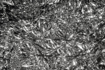 Abstract festive background of a jumble of silver tinsel