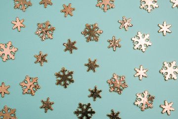 Christmas winter composition. Silver snowflake on blue background. Top view, flat lay
