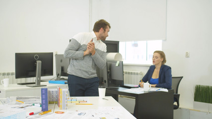 Builder asks about something his colleague during conversation 