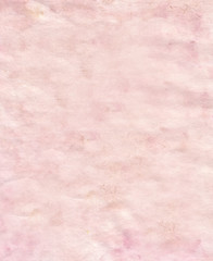Pink paper with a swollen and uneven surface.Texture or background