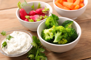 broccoli, radish, carrot and dipping sauce