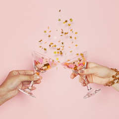 Celebration and holiday backgrounTwo hands chin-chin.
