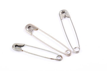 safety pins isolated on white