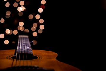 Wooden Acoustic Guitar with Background Lights and Copy Space