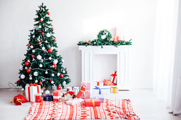Christmas tree with Garland decoration and gifts for the new year