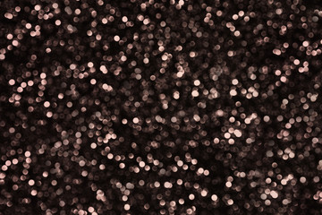 On the surface there are a lot of defocused round balls on a black background.Texture or background