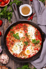 tomato, belle pepper sauce with fried egg and spice