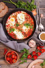 tomato, belle pepper sauce with fried egg and spice