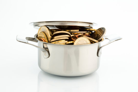 a cooking pot is well filled with euro coins, symbolic picture for subsidies
