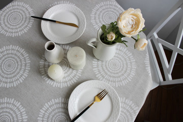 Beautiful table setting on gray background, table with plates top view.