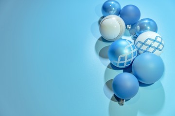Christmas blue background with blue ornaments and crystal Christmas tree , copy space