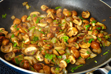 Fried mushrooms in a frying pan