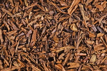 Top view of dried 'Hojicha' tea leaves, a reddish brown roasted Japanese tea made from common 'Bancha' tea