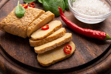 Temper meal served with chili pepper and salt on catering platter