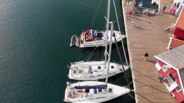 Low altitude drone aerial flight over marina in Smogen, Bohuslan in Sweden