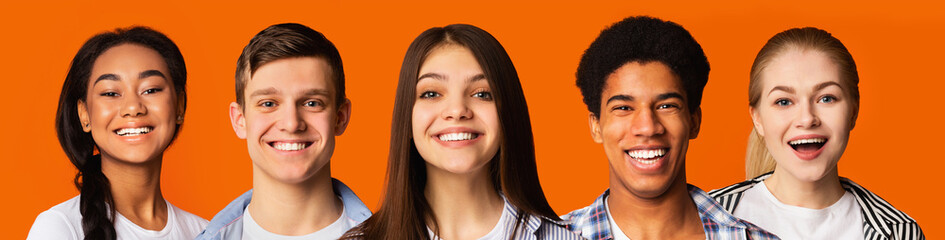 Different happy teens smiling to camera, standing in row