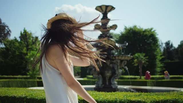 Cheerful girl in the garden of Lednice Palace, Czech Republic