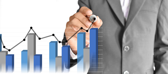 Businessman draw graphs and graph analysis on digital virtual screen technology - Panoramic