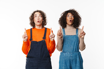 Girls friends in denim jumpsuits