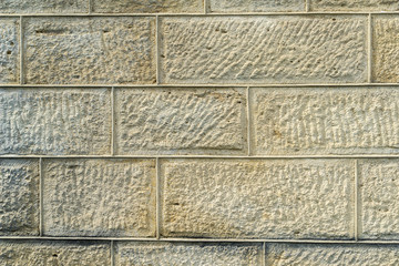 Yellow crimean sawn limestone - traditional porous heat-insulating stone for walls, hedges and construction in Feodosia, Crimea. Natural material known since antiquity. Nature concept for design
