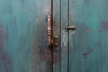 Decorative handle on an vintage green locker