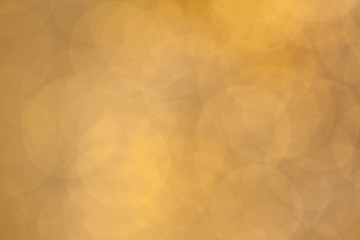 Golden background. Abstract bokeh glitter holiday glowing backdrop