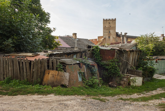 Old houses on the background of a medieval castle