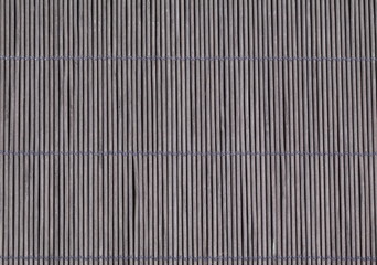 Photo of bamboo mat as abstract texture background side view