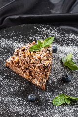 cake with cream on the black background