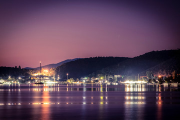 Obraz premium Sailing yacht in a quiet bay at night. Greece. Khalkidhiki