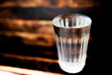 faceted glass of water and empty half half full