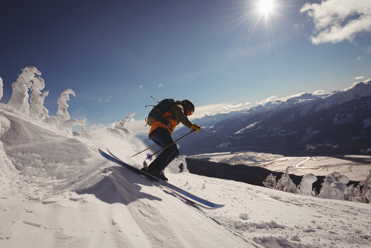 Skier skiing in snowy alps