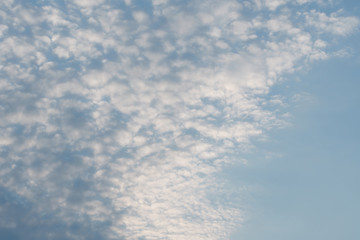 White clouds in the  blue sky diagonally