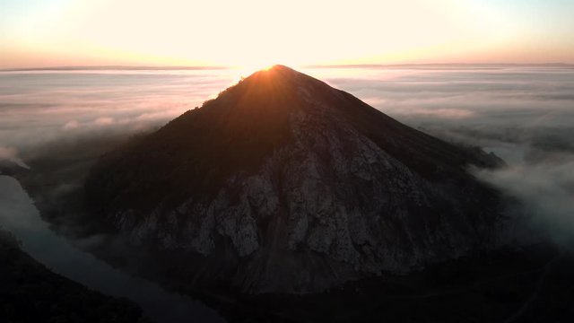 The remain of the reef of the ancient sea, composed of limestone - shikhan Yuraktau. Indian summer in the floodplain of the Belaya River. Aerial view.
