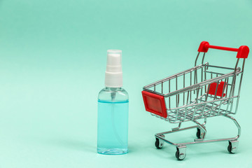 Medicines in shopping cart on blue background.