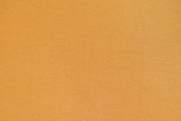 Homogeneous mustard color texture surface. Yellow ocher, fabric, background.