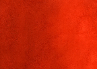 The reverse side of the skin with a textured rough surface of red color.Texture or background