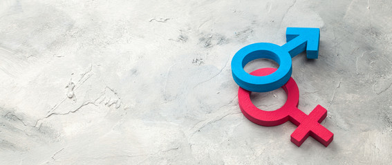 Gender symbols of man and woman on a gray background