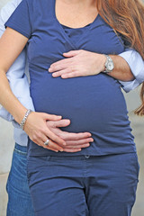 Pregnant woman, belly of a pregnant mother on the ninth month