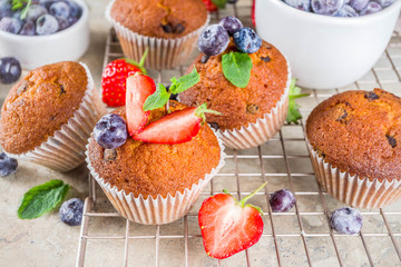 Vanilla muffins or cupcakes with berries