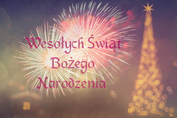 "Wesołych Świąt Bożego Narodzenia"means "Merry Christmas" in Polish. Blurred background of decorated Christmas tree with golden lights. Fireworks. Bokeh. 25 December. 2020. Greeting card Poland.