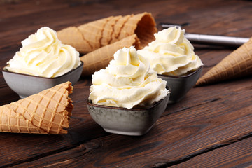 Vanilla soft served ice cream tasty sundae dairy ice cream on rustic background